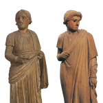 Two statues of masked actors.