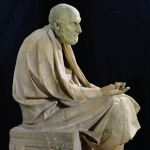 A marble statue of an elderly Greek teaching