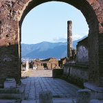 A view through an archway of the forum and Temple of Jupiter at Pompeii